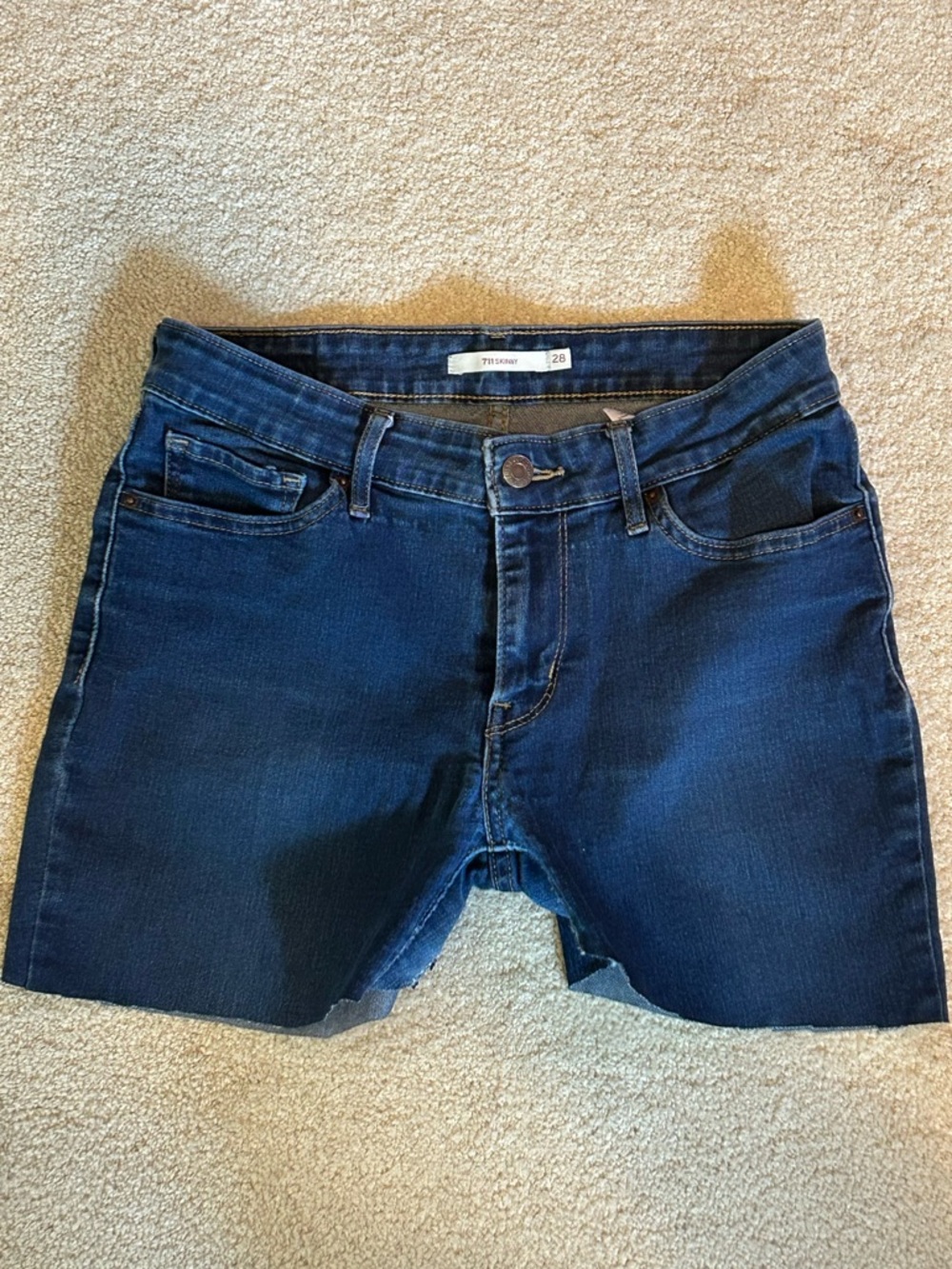 Levi’s Women's Dark Blue Denim Jean cut off shorts waist size 28 item: 256